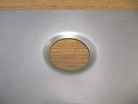 Close-up of sheet metal with a punched and flared hole using 3/4 Inch Dimple Die Set With Punch And Flare Tool Black Finish