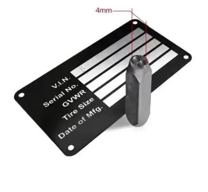 Four Millimeter Steel Die Stamp Kit With 36 Pc Number And Letter Punch Set In Hardened Metal Case Included, shown by engraved plate and punch