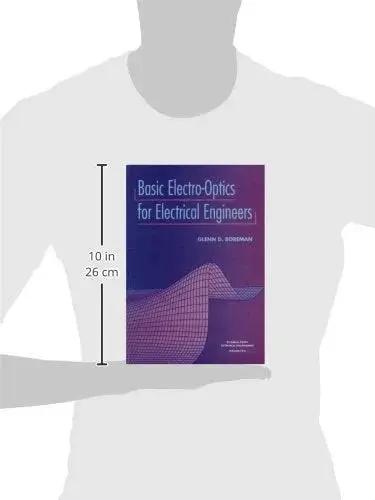 Cover image of 'Essential ElectroOptics For Electrical Engineers A Practical Hands On Guide To Imaging Radiometry Sources Detectors And Lasers For Fast Setup And Real World Back Of The Envelope Calculations SPIE Tutorial Texts In Optical Engineering Vol TT31', held by a silhouette, dimensions shown.