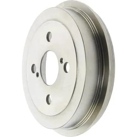 Front view of silver metal rear brake drum with central bore and four mounting holes