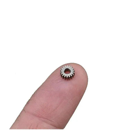 0.3 Module Planetary Gearbox Gear With 5.95 Mm Diameter And 2.55 Mm Inner Hole 18 Teeth shown on a fingertip for scale