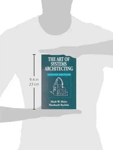 Book: The Art of Systems Architecting, Second Edition, teal cover, front view held by a person.