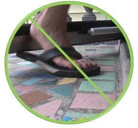 Door closer system, black; circular no-step warning icon with a foot on tiled floor