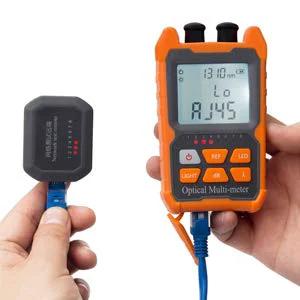 Orange handheld optical fiber power meter and VFL tester with LCD screen and keypad; includes small black sensor module.