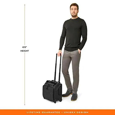 Man holding Baseline Carry On Bag With Smooth Roll 2 Wheel Mobility Softside Luggage That Fits Overhead And Under Seats for effortless travel