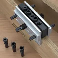 Self Centering Doweling Jig With Six Hardened Drill Bushings on round stock, showing 1/4, 5/16, 3/8 inch bushing sizes and use