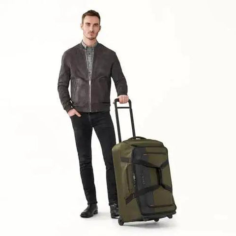 Man with Do It All 27 Inch Medium Upright Duffle With Wheels Softside Checked Luggage Hunter ZDX Collection Briggs And Riley