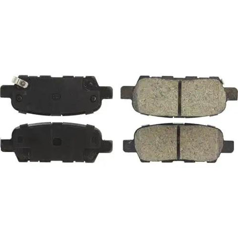Centric POSI-QUIET rear brake pads set of four with beige friction material and dark backing plates.