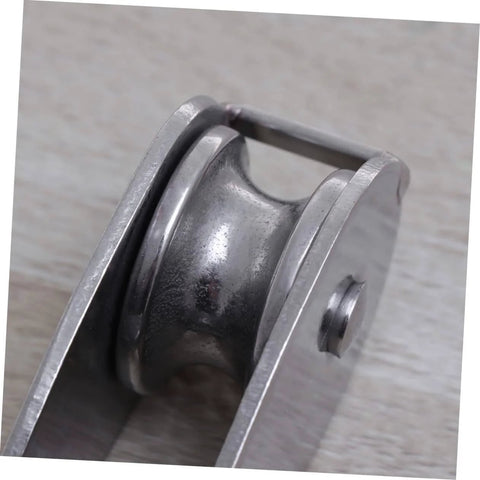 Close-up of a 32mm Stainless Steel Single-Sheaved Pulley Roller Swivel Function Heavy Duty Wire Rope Pulley for Lifting Systems.