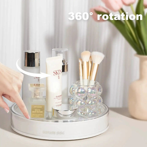 360 Degree Rotating Makeup Organizer With Perfume Tray And Skincare Holder, displaying cosmetics and brushes on a vanity.