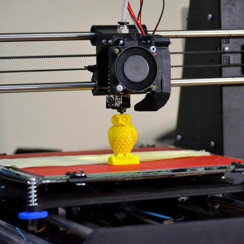 3D printer creating yellow owl figurine, showcasing 3D printing application for Knurled Insert Nuts, 100pcs M3 x 7mm L x 5mm OD.
