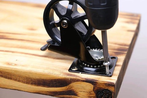 3 Inch Polyurethane Black Mag Designer Caster Set With Non Marking Floor Protection installed on wooden surface