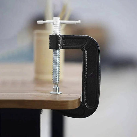 4 Inch Heavy Duty C Clamp securing wood panel, industrial steel clamp for woodworking and welding projects
