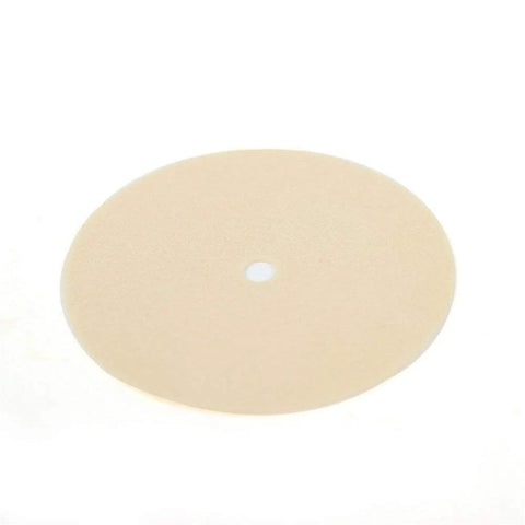 Inhalation valve diaphragm, beige circular disk with small central hole for respirator component