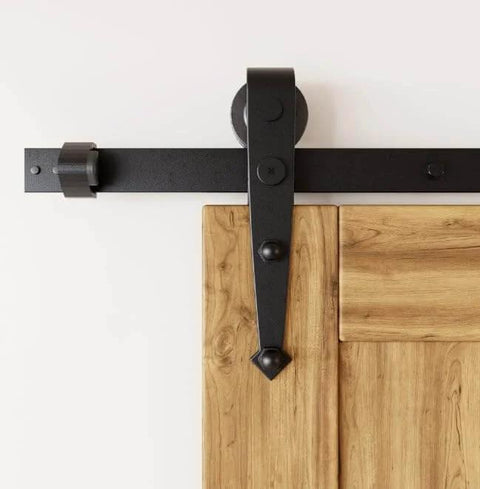 Black Rustic Sliding Barn Door Hardware Kit For Two Doors 13 Foot Flat Track System With Arrow Design Rollers in close-up view