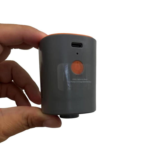 Relime portable mini vacuum pump for vacuum bags, gray cylindrical device with orange button and USB-C port, handheld.