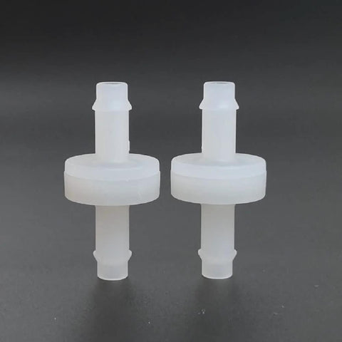 Two white PVDF 1/4 in (6 mm) one-way check valves with barbed ends for ozone spa hoses