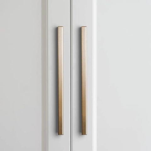 Six Pack Of 5 Inch Champagne Bronze Knurled Cabinet Pulls For Drawers And Dressers With No Slip Grip And Industrial Chic Style From Goo-Ki, Durable Textured Diamond Knurl Hardware, shown installed on white cabinets.