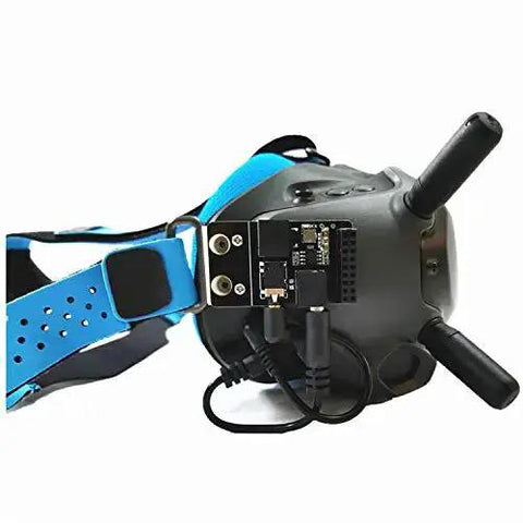 5.8G Analog Receiver Module Adapter Board mounted on FPV Goggles with blue strap for enhanced FPV video reception in aerial racing.