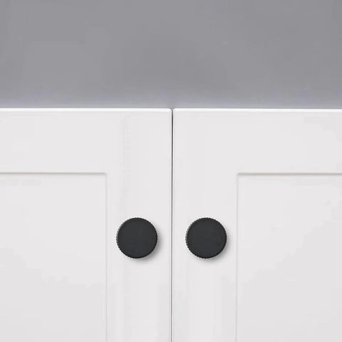 Matte Black Cabinet Knob Set Five Pack For Kitchen Drawers And Furniture Doors installed on white cabinets