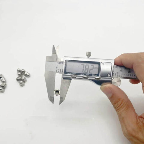 Digital caliper measuring 30 Pack M5 Action Camera Thumb Screws Caps, Stainless Steel End Tips showing 7.82mm, caps visible in background