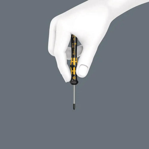 ESD Safe Kraftform Micro Slotted Screwdriver With Anti Roll Handle held in hand, ergonomic grip, 0.30 x 1.8 x 60 mm size, close-up