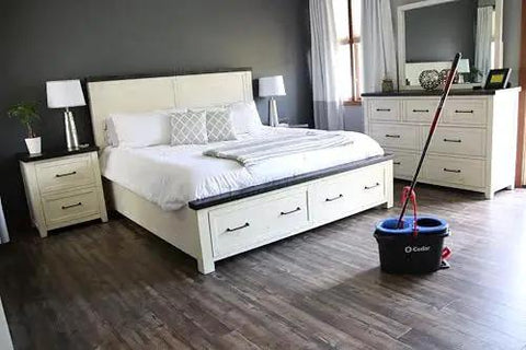 RinseClean Spin Mop And Bucket System For Clean Water Mopping Lets You Clean With Clean Water From Start To Finish Removes 99 Percent Of Bacteria With Just Water Built In Foot Pedal For Hands Free Wringer And Easy Rinse visible in bedroom with wood floors.