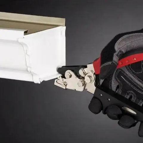 Snap Lock Punch For Gutters With Adjustable Throat Depth From One Quarter Inch To Five Eighths Inch, silver finish tool in use