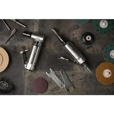 Lightweight One Quarter Inch Right Angle Air Die Grinder With Twenty One Thousand RPM, Ball Bearing Construction, Aluminum Housing, Safety Lock, and Built Tough for Tight Spots From Ingersoll Rand, with accessories on a workshop table.