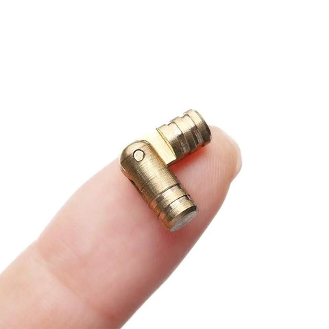 Close-up of a small copper hinge on finger, part of 10Pcs Invisible Concealed Copper Barrel Hinges For Cabinets And Jewelry Boxes Hidden Brass Hardware 5mm x 20mm Durable Easy Install DIY Furniture Renovation And Craft Projects