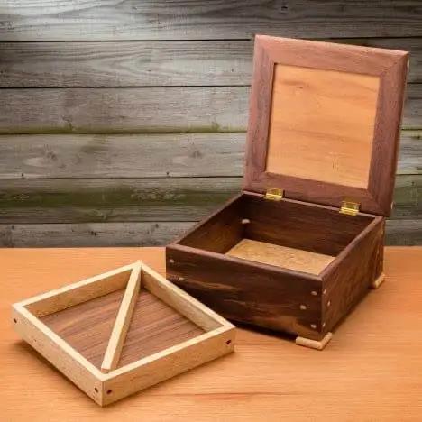 Wooden box with lid detached, showcasing Corner Key Doweling Jig for Decorative Mitered Joints With Molded Reference Lines and Drill Guides