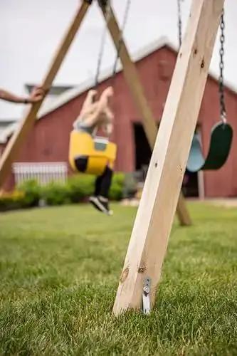 Playset Anchor Kit for Swing Sets Heavy Duty Ground Anchors securing wooden swing set outdoors