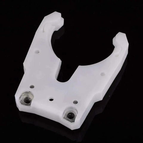Pro Grade Tool Holder Clamp For CNC Machines And Automatic Tool Change Systems with spindle fork, ABS metal build, top view.