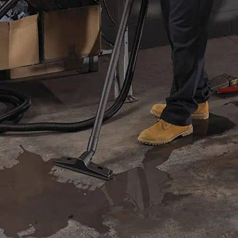 1.5 Inch Diameter Wet Dry Vacuum Accessory Kit With 2 Extension Wands, Elbow Grip, And 12 Inch Floor Nozzle in use cleaning wet floor