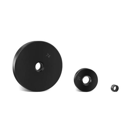Set of three black discs from 52 In 1 Custom Bushing Driver Set For Transmission And Axle Bearings Replacement, displayed in increasing size.