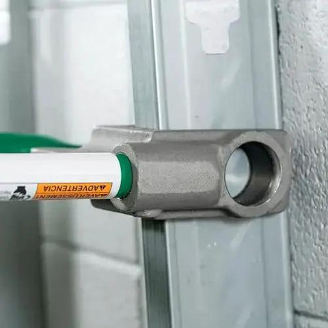 One Stroke Manual Metal Stud Punch Tool 1-11/32 Inch with aluminum head in use on steel stud, creating clean hole for wiring.