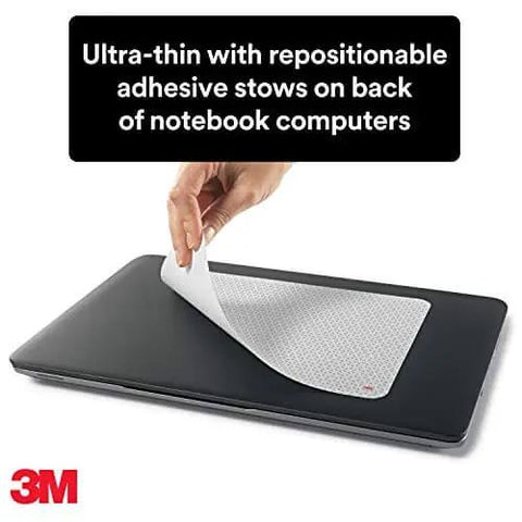 Person peeling Precise Mouse Pad With Repositionable Adhesive Back For Optical Mice At High Speeds off a notebook