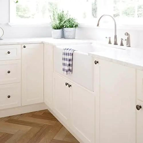Installed view of Fulton Soft Iron Round Cabinet Knobs One And Three Sixteenth Inch Easy Install Durable Hardware on kitchen cabinets