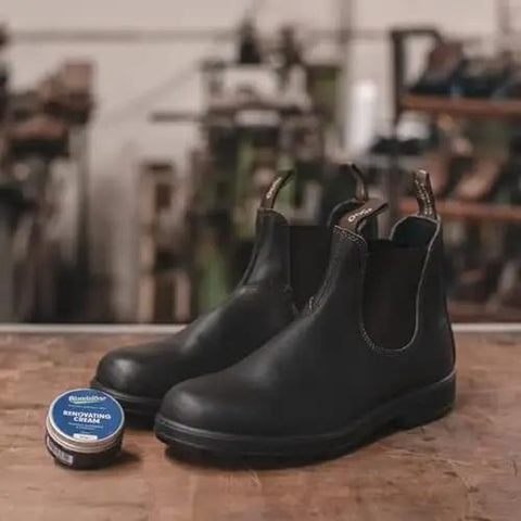 Leather Care Renovating Cream For Rustic Leather To Nourish And Condition Boots And Shoes From Blundstone keeps leather supple displayed with black Blundstone boots.