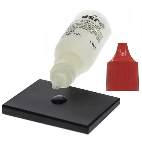 18K Gold Testing Solution Purity Determiner For Jewelry And Scrap Metal Quick Karat Test To Verify Gold Content In Jewelry Coins Bars And Scrap Easy Drop Test With Instant Results Made In USA; clear solution bottle with red cap and test surface