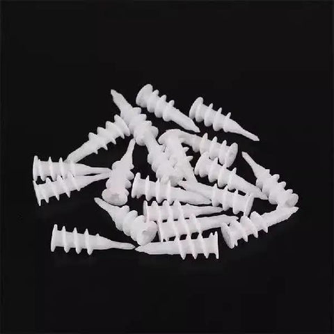 Pile of white self drilling drywall anchors from Self Drilling Drywall Anchors Set 100 Pcs With Screws And Reusable Storage Case Durable Plastic