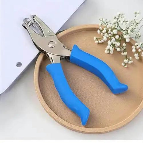 Blue One Circle Hole Punch With Soft Grip Handheld Paper Punch for crafts on wooden tray