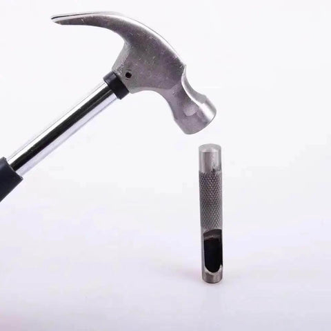 Hammer next to steel hollow punch from Three Piece Grommet Hole Punch Set With Steel Hollow Punches For Leatherworking And Crafts Includes Quarter Inch Three Eighths Inch And Half Inch Sizes Heavy Duty Steel Construction