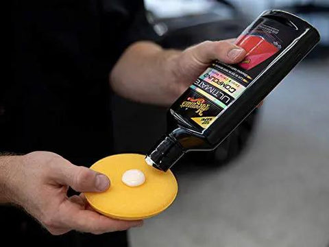 Ultimate Compound Pro Grade Car Scratch Remover For Killer Shine And Glossy Paint Finish Defect Removal Paint Correction Compound For Single Stage And Clear Coat 15.2 Oz. applied to a foam pad.