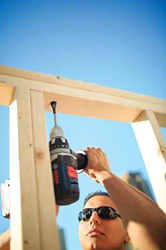 Person using Daredevil Standard Spade Bit 1 Inch By 6 Inch For Quick Drilling And Clean Holes With Full Cone Threaded Tip.