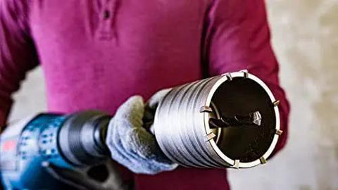 Person holding Beefed Up Heavy Duty SDS Max Rotary Hammer Core Bit for Concrete by Bosch, 2 Five Eighths In X 22 In, carbide tipped