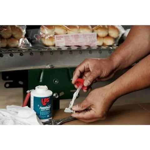 Person applying Food Grade Paste Anti Seize Lubricant For Plastic And Steel 0.5 Lb Can Heavy Duty to metal part