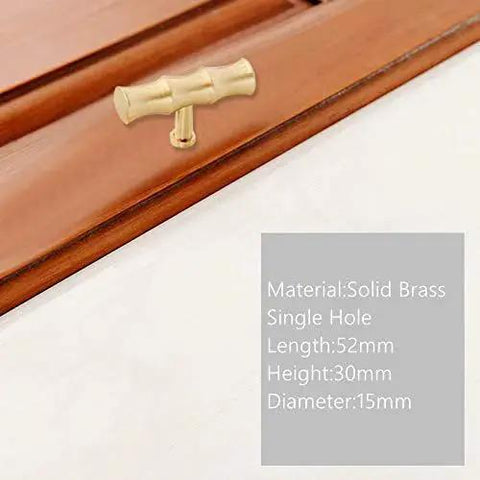 Bamboo Brass Kitchen Cabinet Knobs 52mm Long 30mm High TBar Pull Handles in Brushed Gold Installed on Wooden Cabinet
