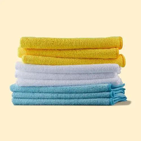 Stack of colored Microfiber Cleaning Cloths 16x12 24 Pack Lint Free Streak Free Reusable Washable in yellow, white, and blue.