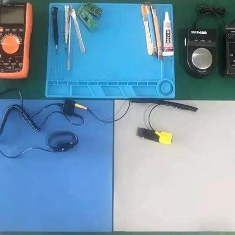 Essential ESD Grounding Kit For Workbench Table Mat And Wrist Straps Dual 4mm Copper Ground Cords setup with tools on table